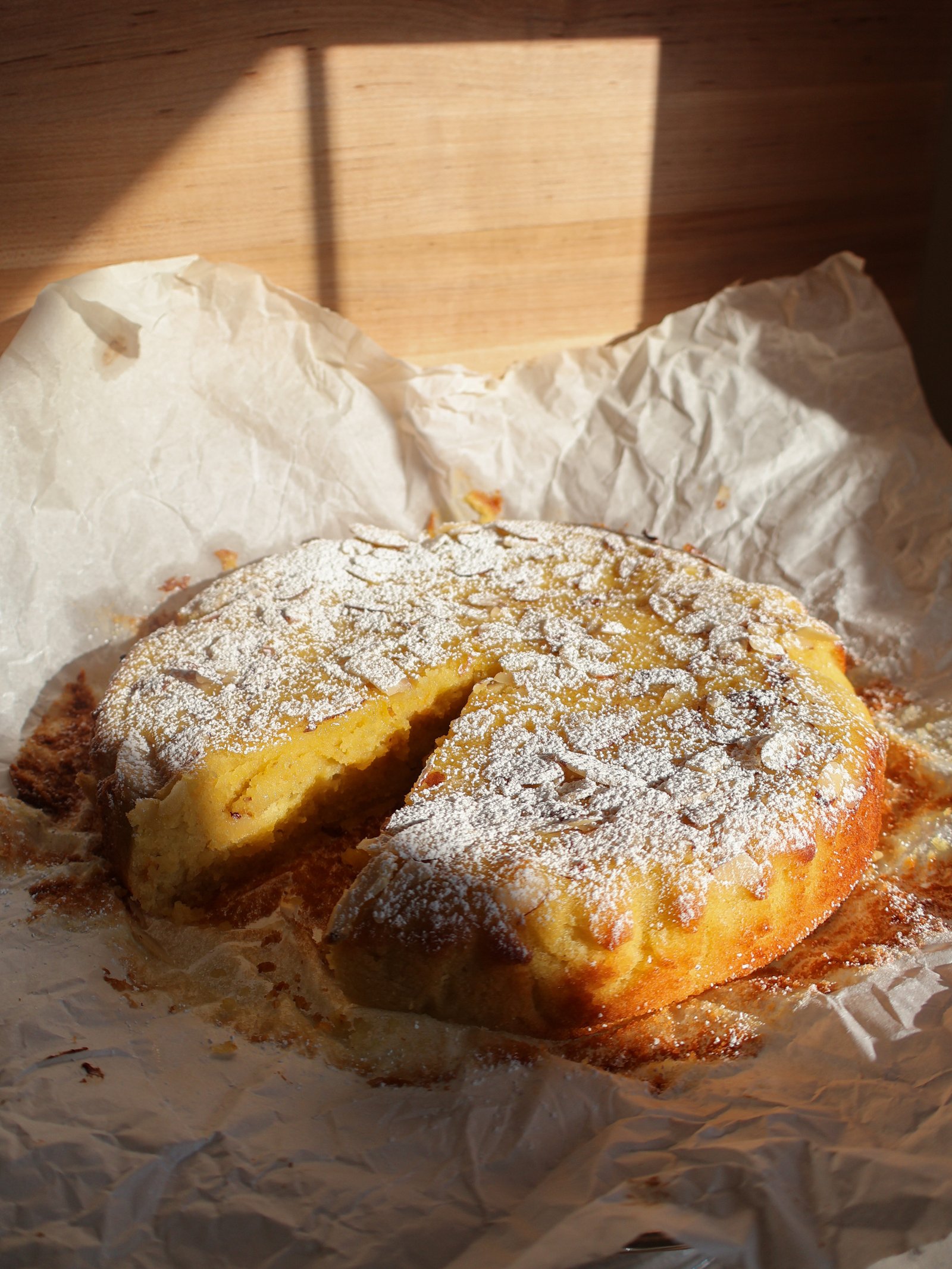 orange cake with almonds dusted with powdered sugar